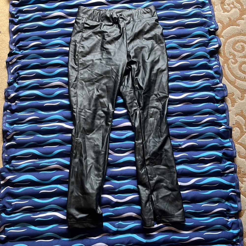 Previously owned, excellent condition black leather pants